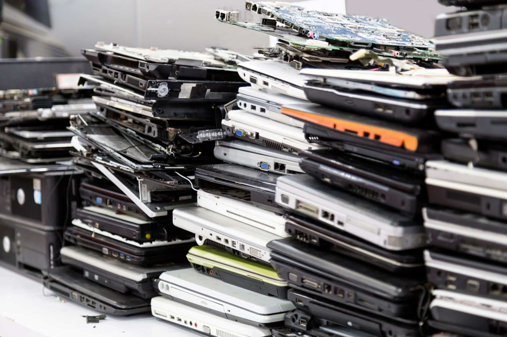 Stacks of broken laptops